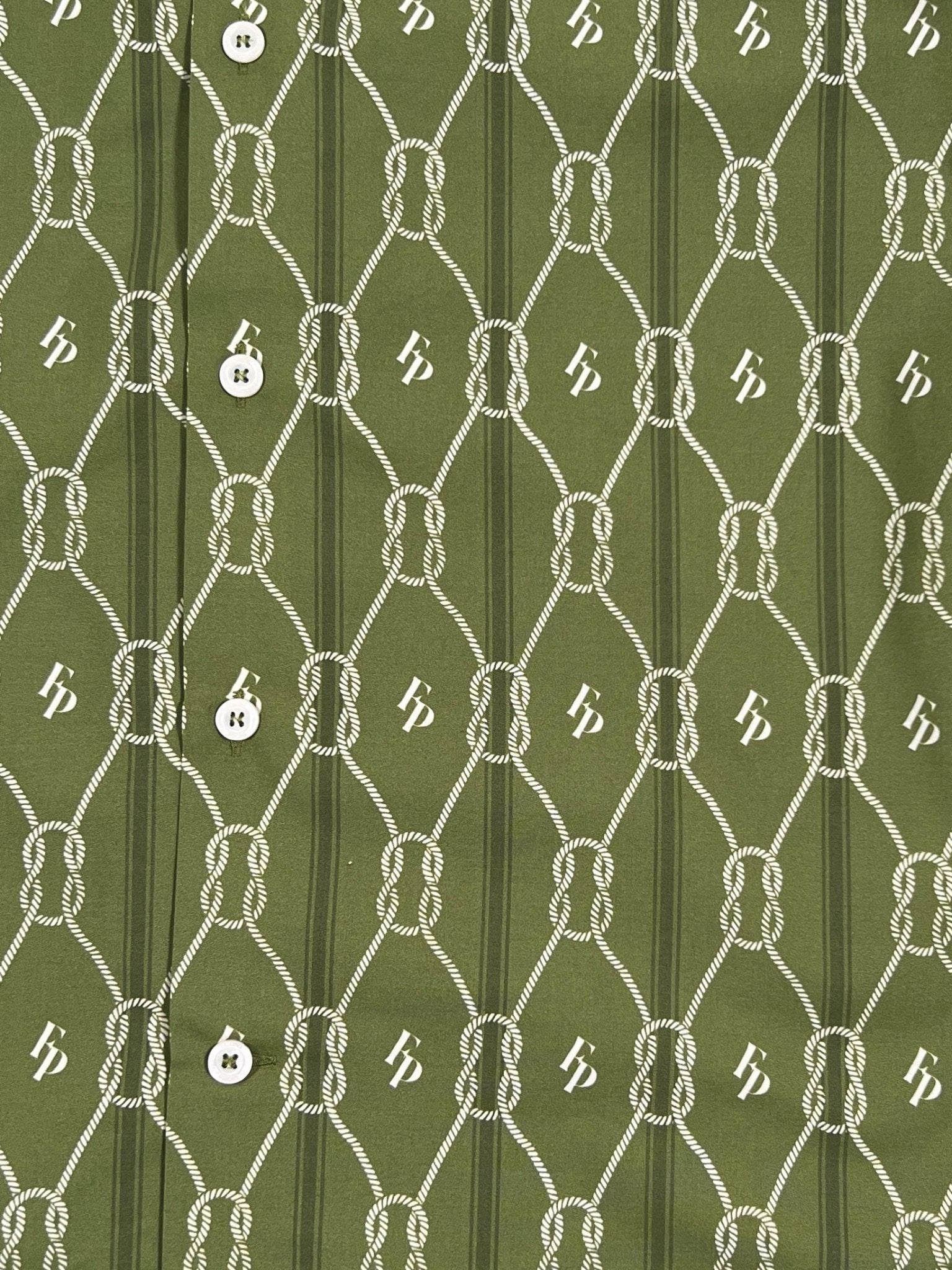 The Filling Pieces Resort Monogram Shirt Olive by FILLING PIECES is a short sleeve shirt made from 100% organic cotton, showcasing a white rope pattern with button details and an all-over repeating "b" design.
