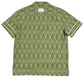 Back view of the Filling Pieces Resort Monogram Shirt Olive by FILLING PIECES, featuring an all-over white geometric pattern on a short-sleeve olive green design.