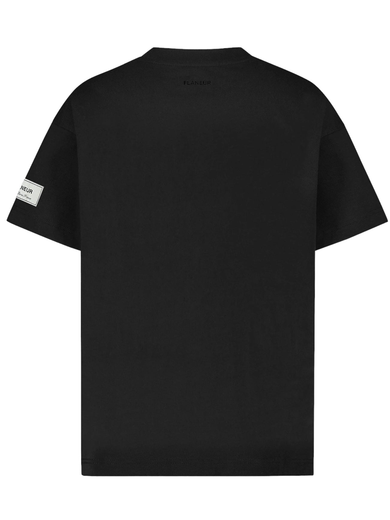 Back view of the Flaneur Atelier T-Shirt Black by FLANEUR in soft cotton jersey, featuring a subtle Flâneur-Atelier patch on the left sleeve.