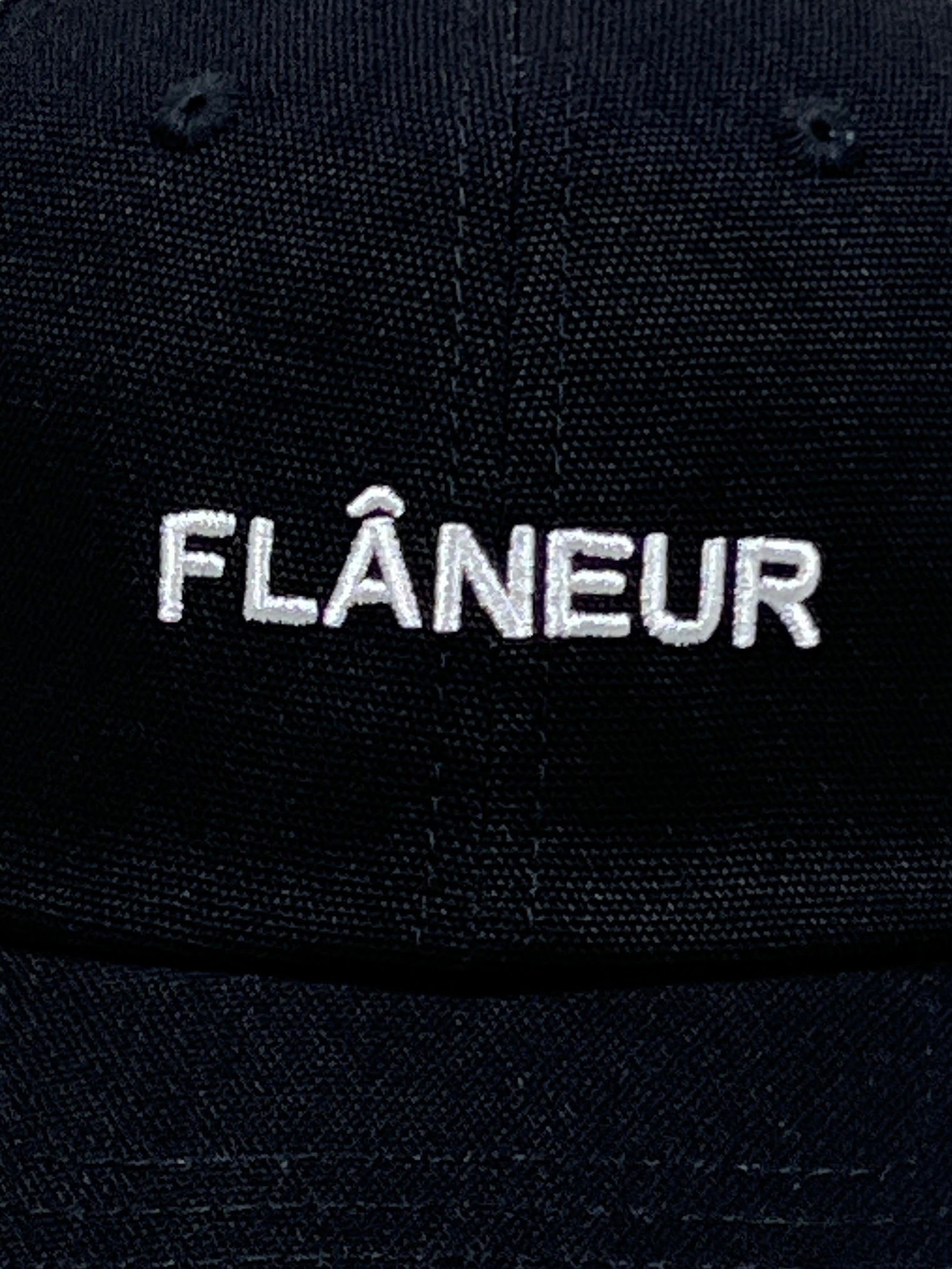 Check out the Flaneur Logo Cap Black by FLANEUR, featuring "FLÂNEUR" beautifully embroidered in white on the front. Made from premium cotton, it blends style and comfort perfectly for today's wanderer.