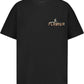 The FLANEUR Passage of Time T-Shirt Black features a cotton build with "FLÂNEUR" and a small reclining figure graphic printed on the left chest.