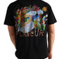 Someone wearing the FLANEUR Passage of Time T-Shirt Black, featuring colorful artwork and "FLANEUR" printed on the back.