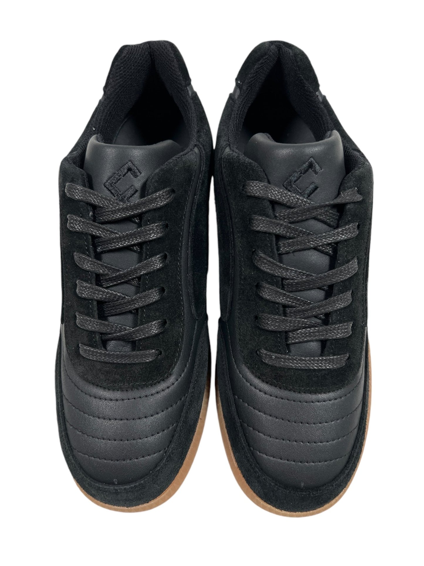 A top-view image of the FLANEUR TIVOLI RUNNER BLACK sneakers, featuring black laces, a brown rubber sole, and crafted from calfskin leather by the brand FLANEUR.