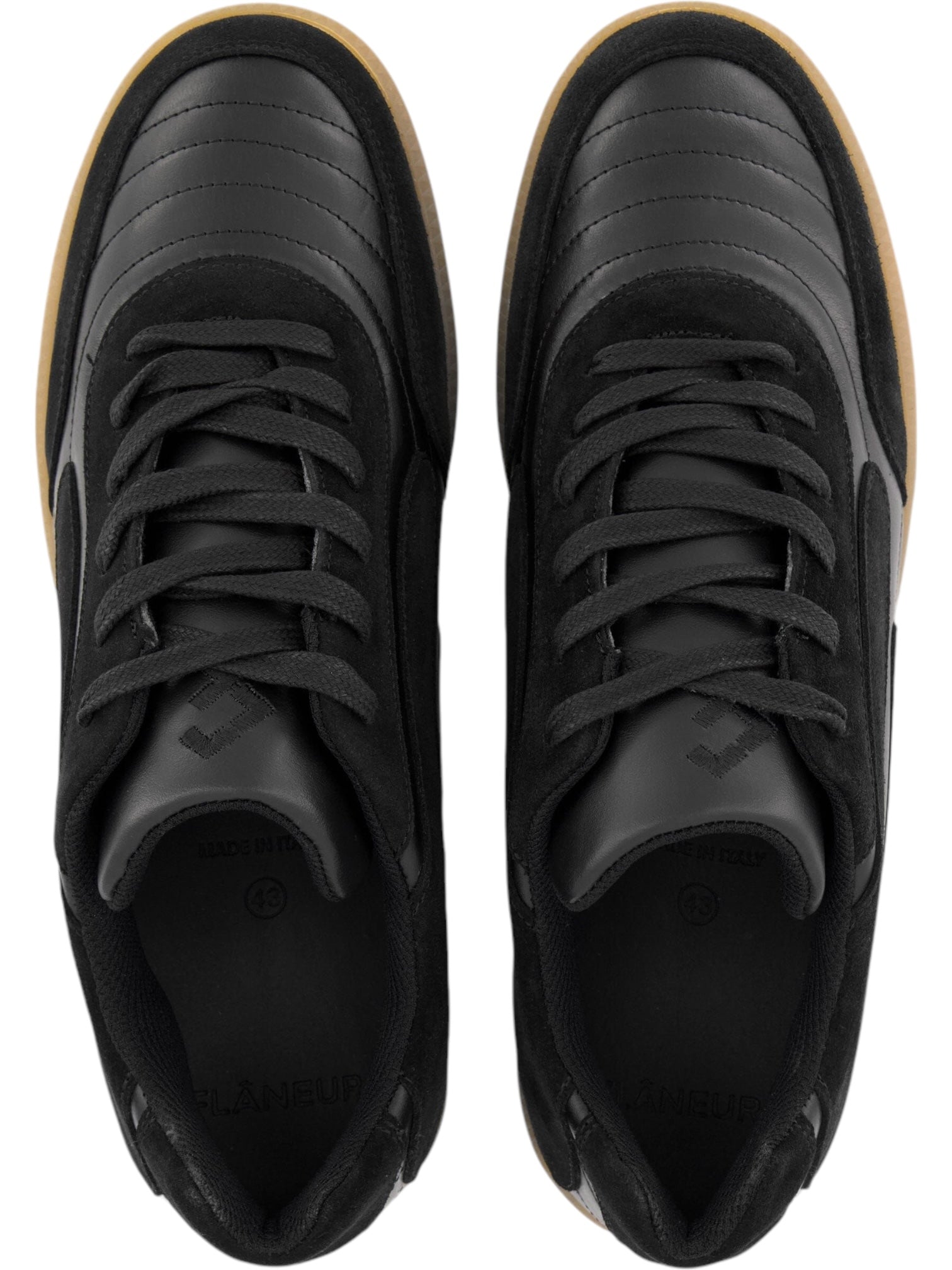 The FLANEUR Flaneur Tivoli Runner Black features sustainable black uppers, gum soles, and detailed laces and stitching, seen from above.