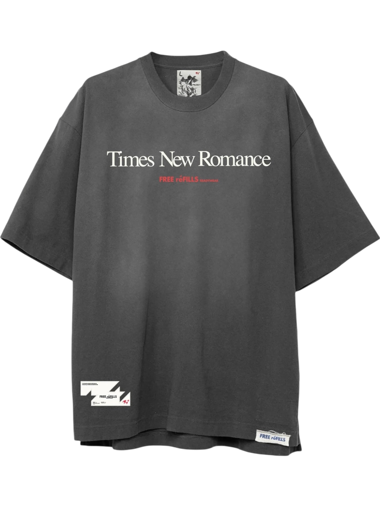 The FREE REFILLS Free Refills Romance Tee (FR-C3-12) in vintage black is an oversized heavyweight cotton t-shirt with a faded wash, "Times New Romance" in white, "FREE refILLS" in red, and label details by the hem.