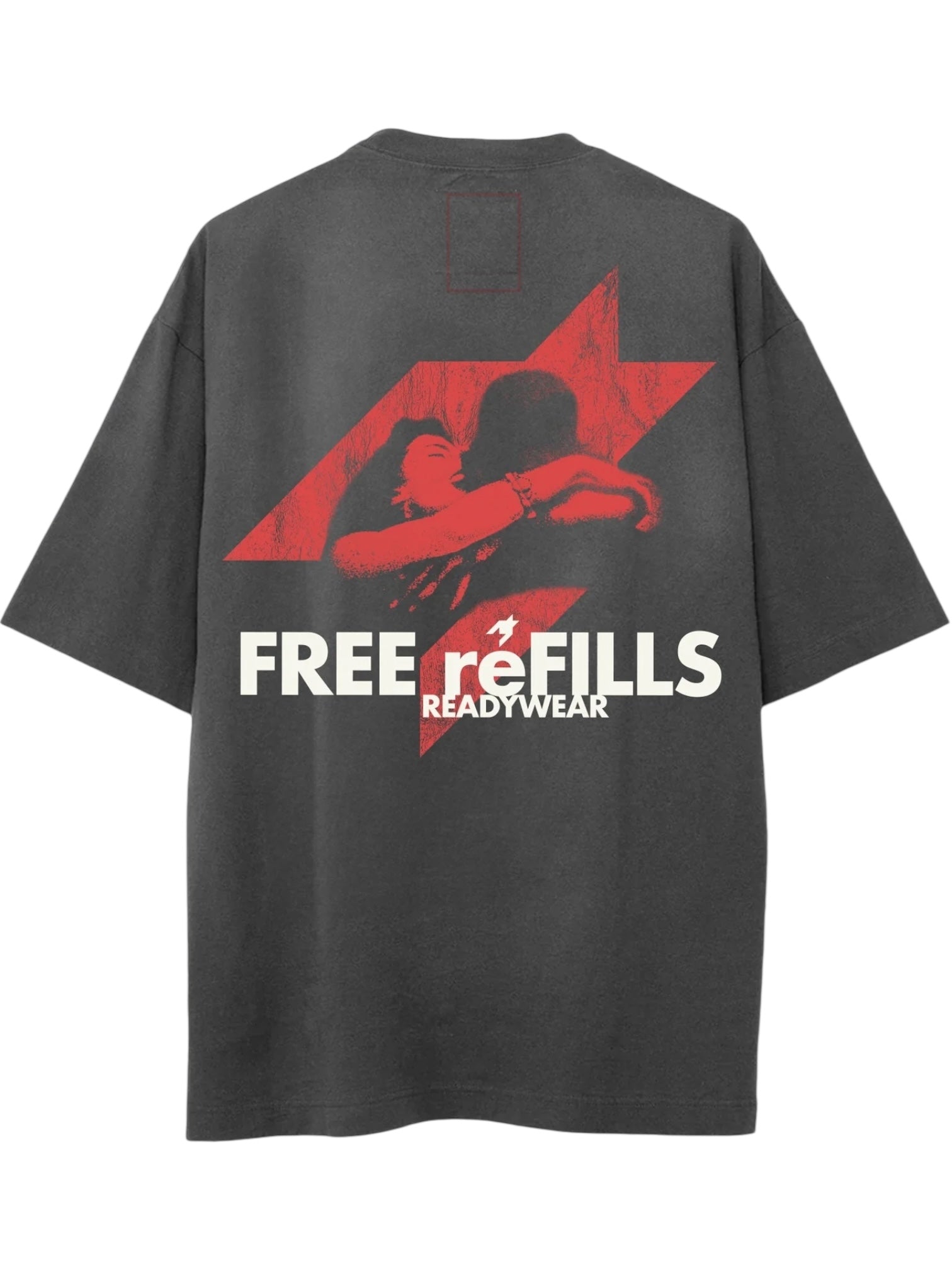 The FREE REFILLS Free Refills Romance Tee (FR-C3-12) in Vintage Black is a heavyweight cotton T-shirt with a vintage fade, bold red lightning bolt, embracing couple graphic, and "FREE reFILLS READY TO WEAR" text on the back. True to size fit.