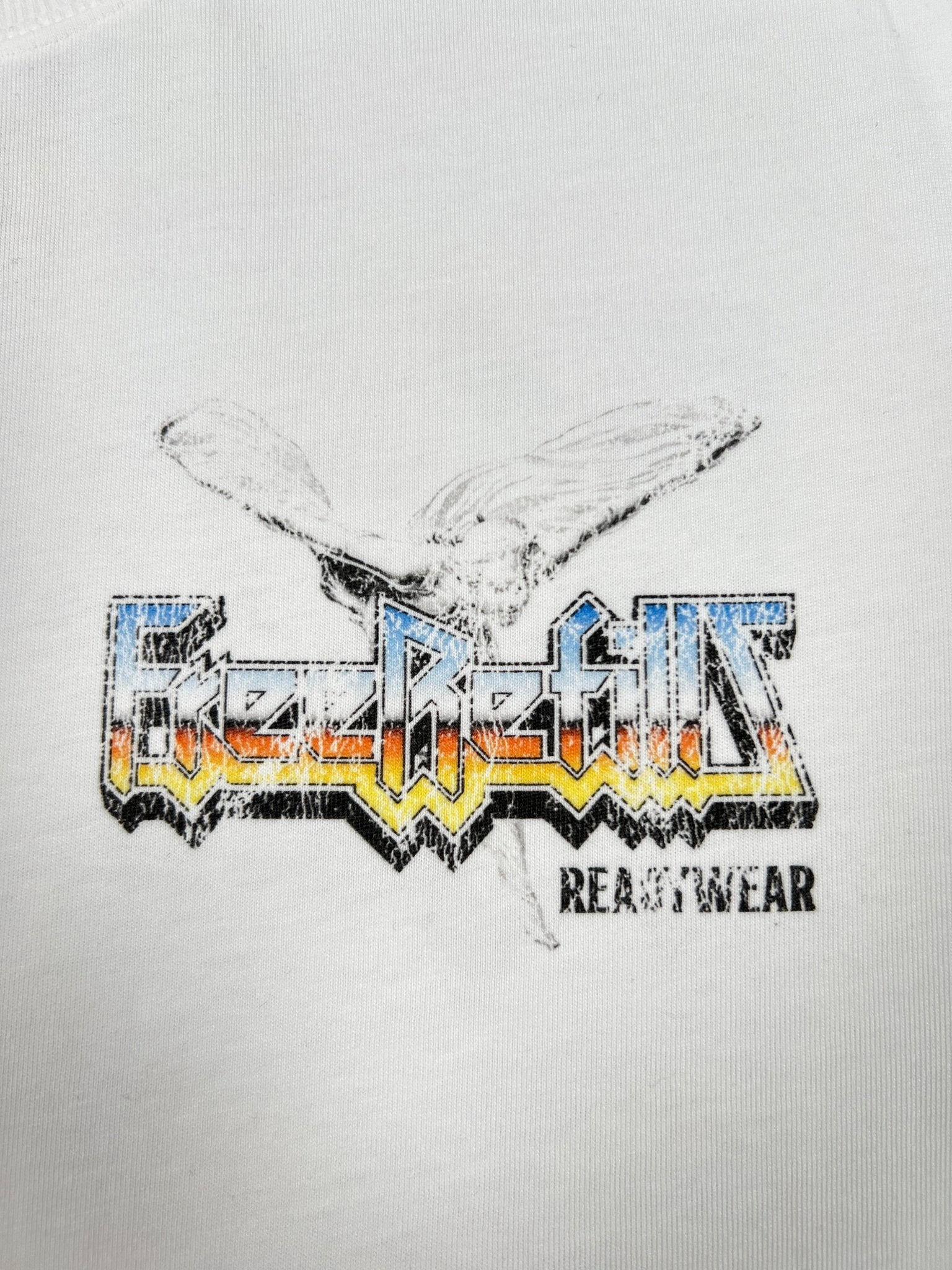 The Free Refills Showcase Tee (FR-C3-7) White by FREE REFILLS features a bird graphic above "FreeRefills" text with "BEASTWEAR" below—a bold cotton t-shirt for standout style.