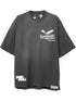 The Free Refills Showcase Tee (FR-C3-8) in vintage black by FREE REFILLS is an oversized graphic t-shirt featuring an eagle, "FREE FIGHTS READTWEAR" text, unique Free Refills vibe, small front text, and tags near the hem.