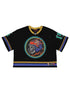 The GODSPEED First Down Jersey Black/Yellow/Blue features retro-sport style with yellow, green, and blue trim, a bold flaming skull graphic on the front, and a patch at the hem—ideal for streetwear enthusiasts.