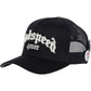 The GODSPEED Godspeed Gs Forever Hat Black is a limited edition black mesh trucker hat with color-changing "Godspeed Fever" embroidery on the front and an "I ♥ GS" pin attached to the side.