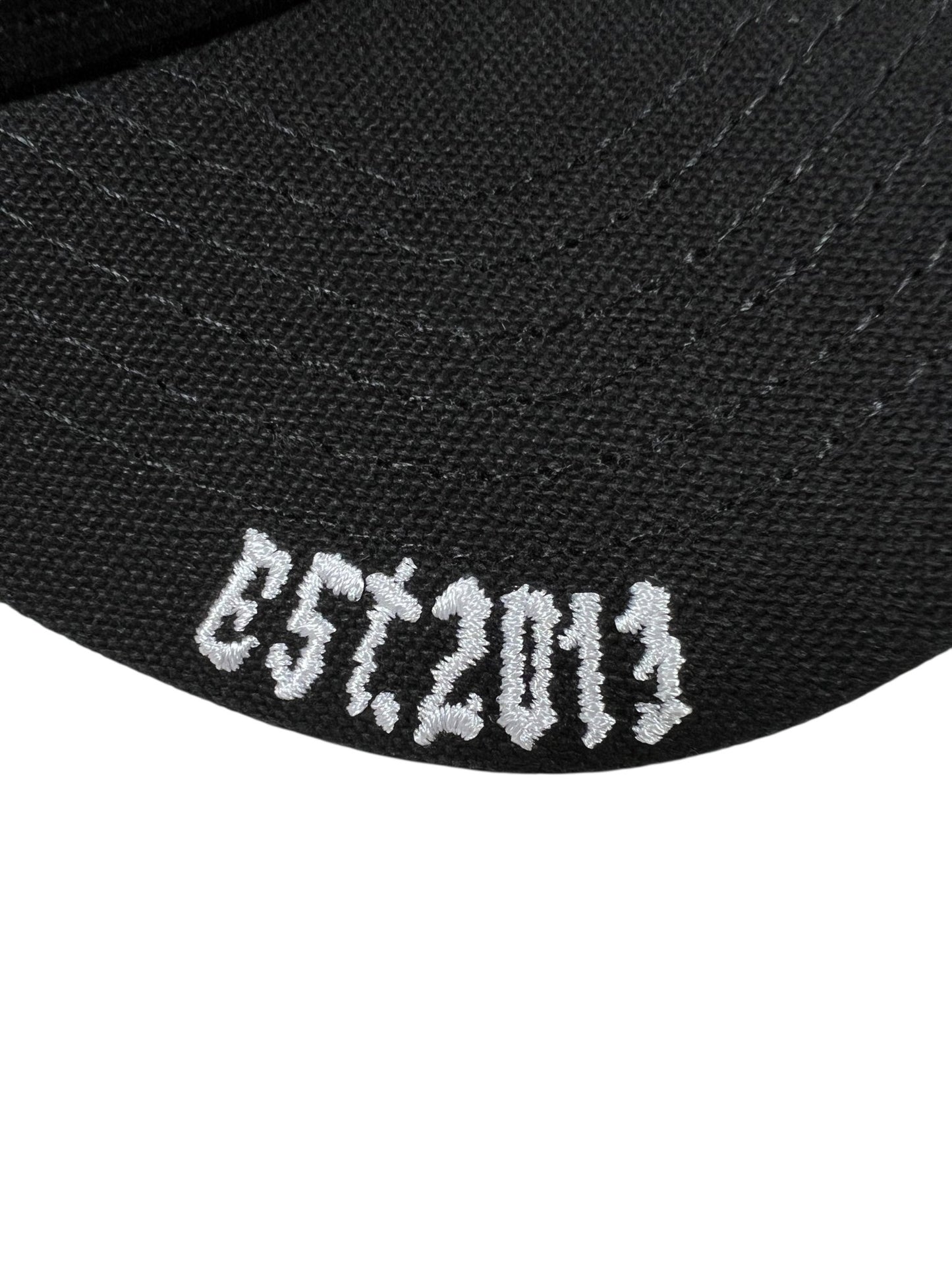 Close-up of the GODSPEED Godspeed GS Forever Trucker Gradient Hat Hawaiian, a limited edition black hat with white "EST. 2013" embroidery.