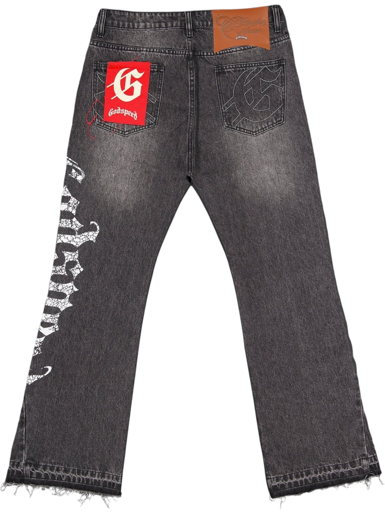 The Godspeed OG Logo Flared Denim Grey Wash by GODSPEED features grey 100% cotton denim, a red patch with OG logo on the back pocket, white graphic text along one leg, and frayed hems.