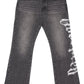 The GODSPEED Godspeed OG Logo Flared Denim Grey Wash jeans feature 100% cotton, a flared cut, classic grey wash, white logo print on the right thigh, and a yellow label on the inner waistband for timeless style.