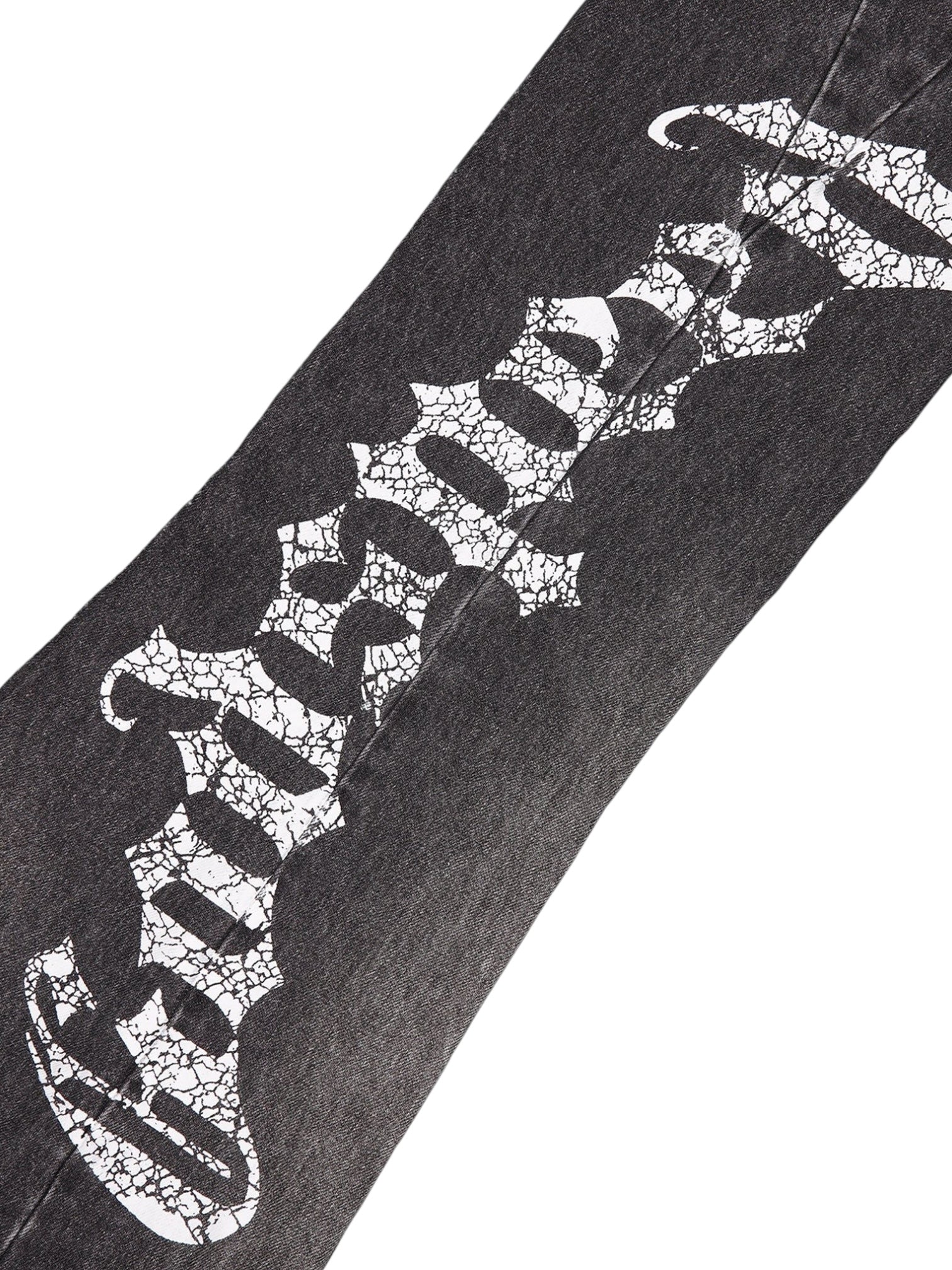 The GODSPEED OG Logo Flared Denim Grey Wash features black 100% cotton denim with a grey wash and bold, cracked white "godspeed" Gothic-style print on the legs.