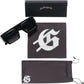 The GODSPEED OG Sunglasses Black Ice come with thick frames, a black signature case, a bold "G" cleaning cloth, and a matching pouch—all shown on a white background for stylish eye protection.