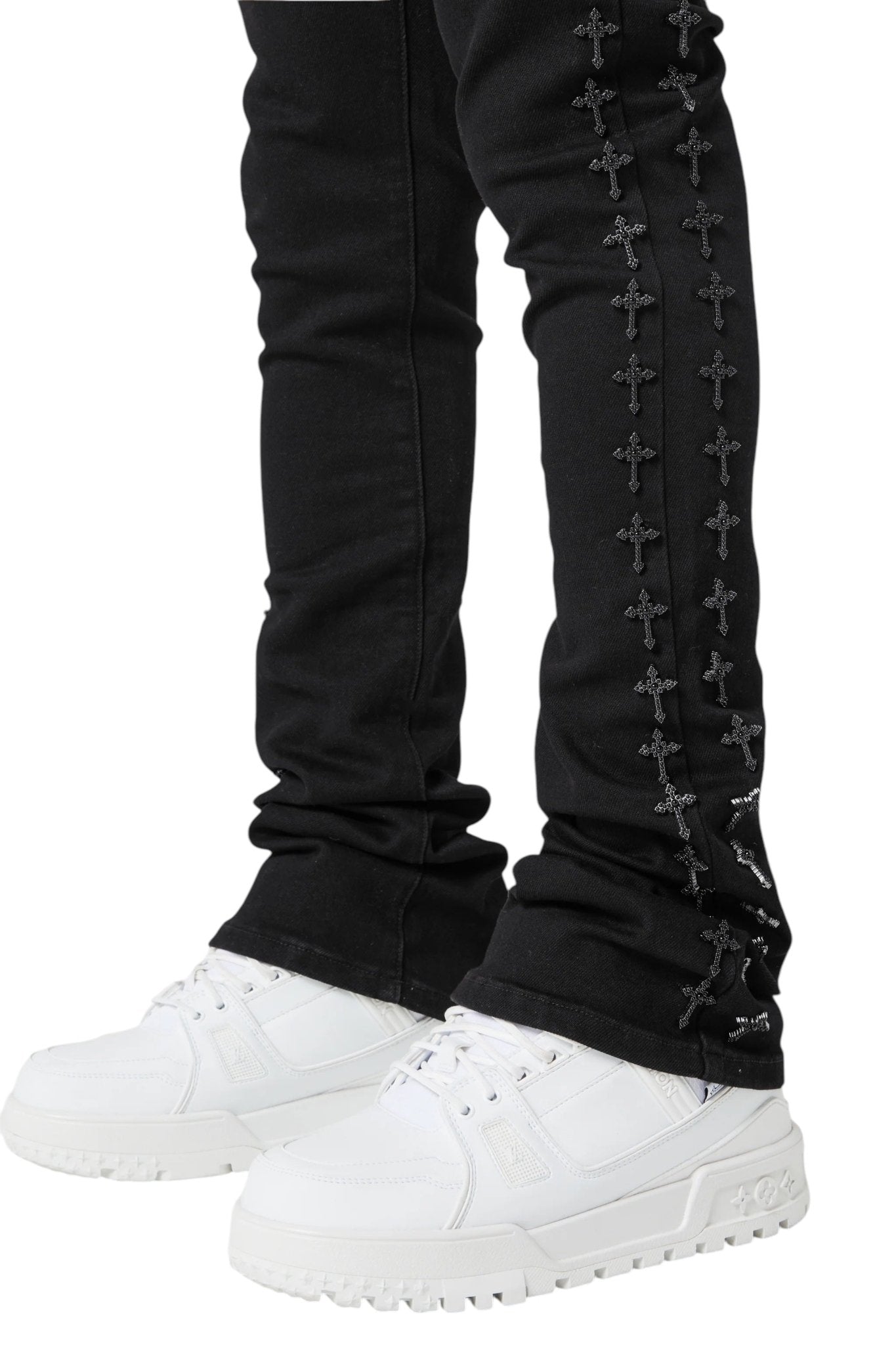 Wearing Guapi All Black Crosses Embellished Denim from GUAPI perfectly captures the essence of streetwear, especially when paired with crisp white sneakers.