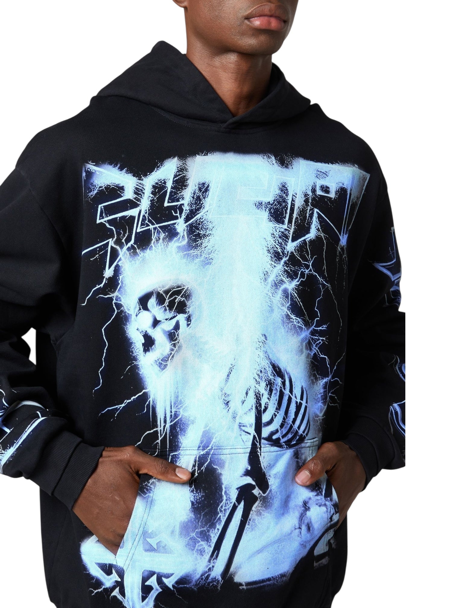 Wearing the Guapi Black Revived Hoodie V2 by GUAPI, featuring a bold blue lightning and skeleton graphic, hands in the front pocket—an essential for any streetwear hoodie collection.