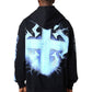 Someone wears the Guapi Black Revived Hoodie V2 by GUAPI, which features a large glowing blue cross with lightning effects on the back, standing against a plain background.