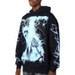 A man wears the GUAPI Guapi Black Revived Hoodie V2 with blue lightning and skeleton graphics on the front and sleeves, standing against a white background.
