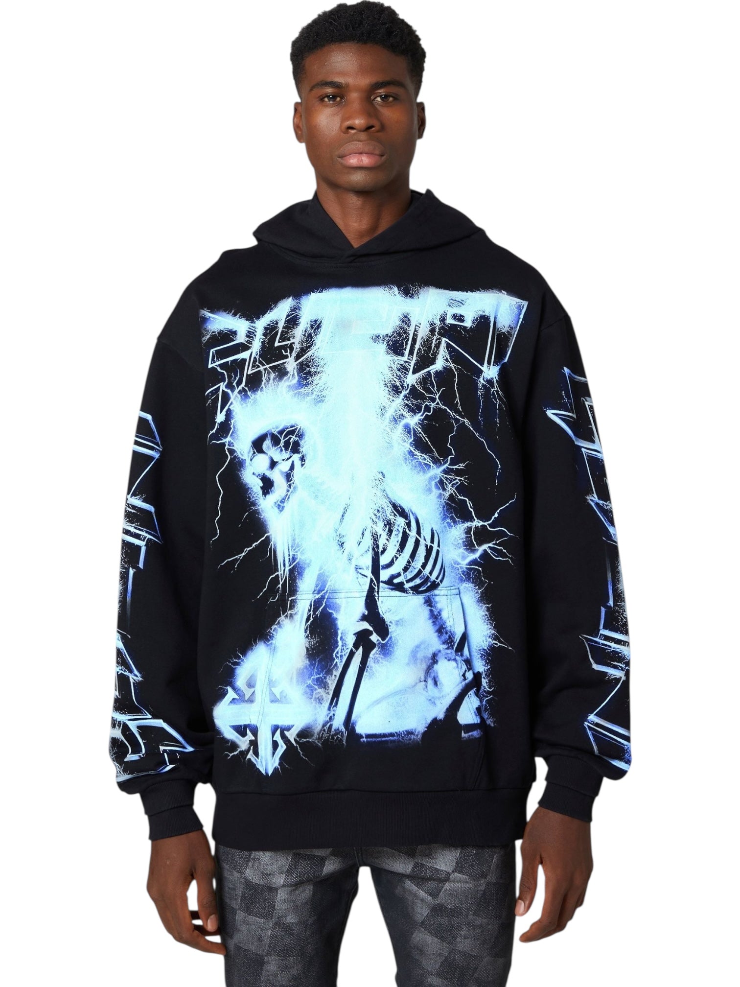 A man wears the GUAPI Guapi Black Revived Hoodie V2, featuring blue lightning and skeleton graphics, while facing forward against a white background.