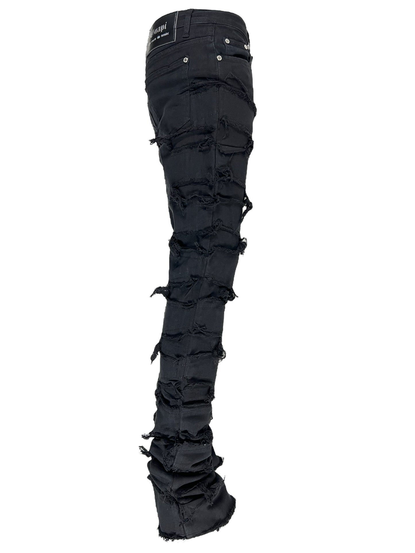 GUAPI OBSIDIAN BLACK BLOOD DIAMOND STACKED DENIM jeans with multiple horizontal rips down the legs.