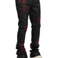 Someone is wearing Guapi Obsidian Black Icon Embellished Denim V2 by GUAPI, paired perfectly with white sneakers.
