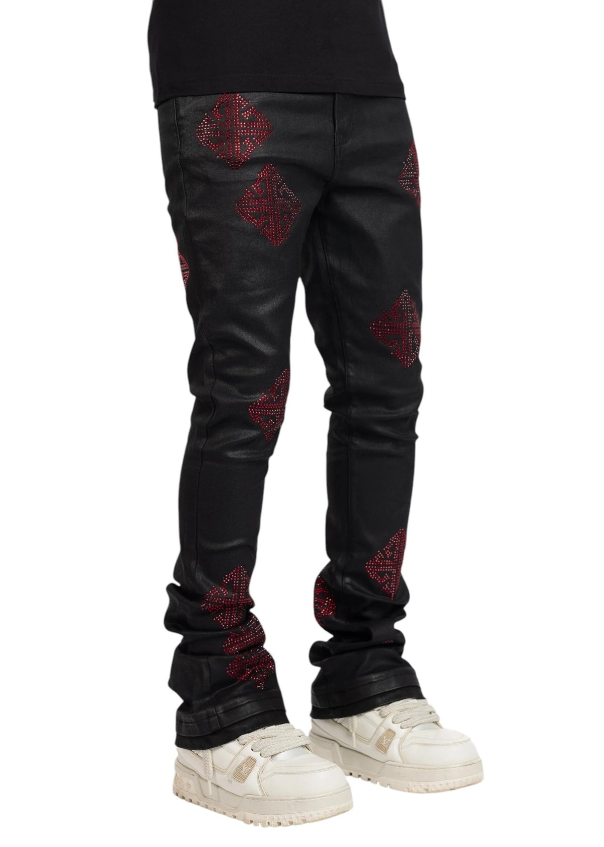 Someone is wearing Guapi Obsidian Black Icon Embellished Denim V2 by GUAPI, paired perfectly with white sneakers.