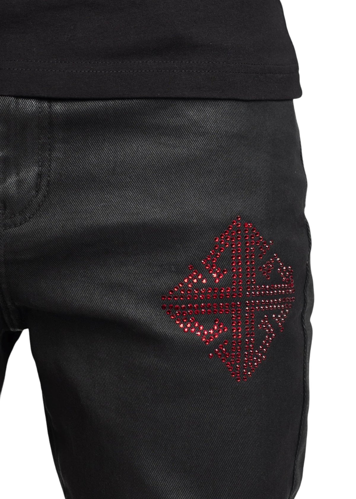 Close-up of GUAPI's limited edition Obsidian Black Icon Embellished Denim V2, showcasing a red, studded geometric pattern on the thigh.