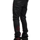 Wearing GUAPI's limited edition Guapi Obsidian Black Icon Embellished Denim V2 with red accents and white sneakers, viewed from the back.