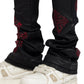 A person wearing GUAPI's Obsidian Black Icon Embellished Denim V2 with white sneakers.