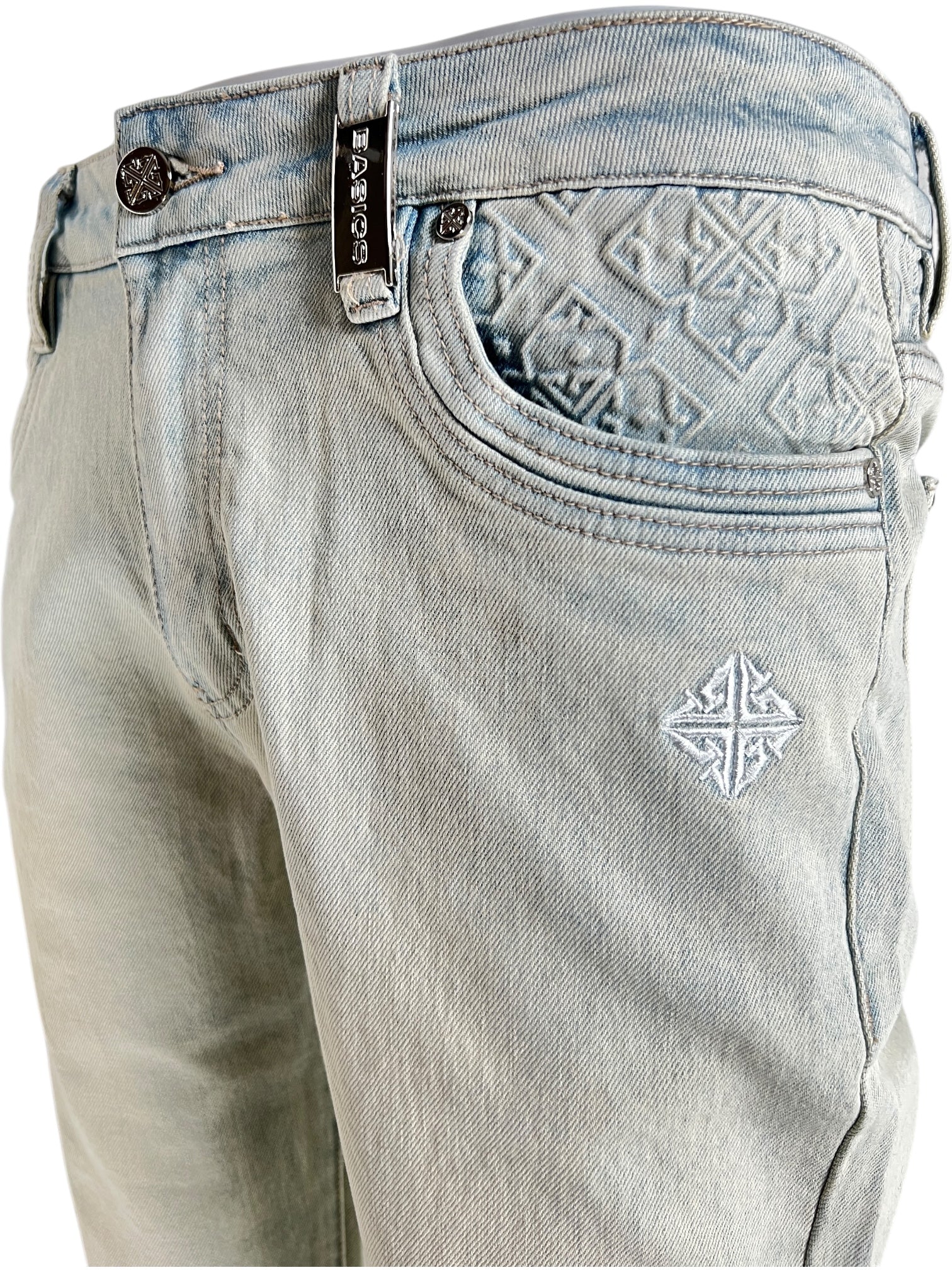 Close-up of GUAPI Vintage Blue Basics Regular Denim V2 jeans, regular fit, with embroidered geometric details on the coin pocket and thigh, plus a branded waistband tag.