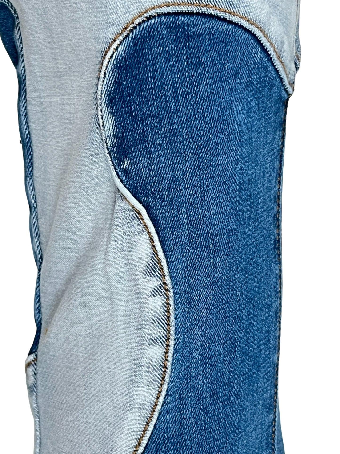 GUAPI VINTAGE BLUE WAVY DENIM patch on a gray shirt with visible stitching.