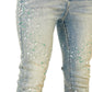 Close-up of GUAPI Guapi Vintage Olive Pearls Denim skinny jeans, featuring white and green beads arranged in a scattered pattern on the front and sides.