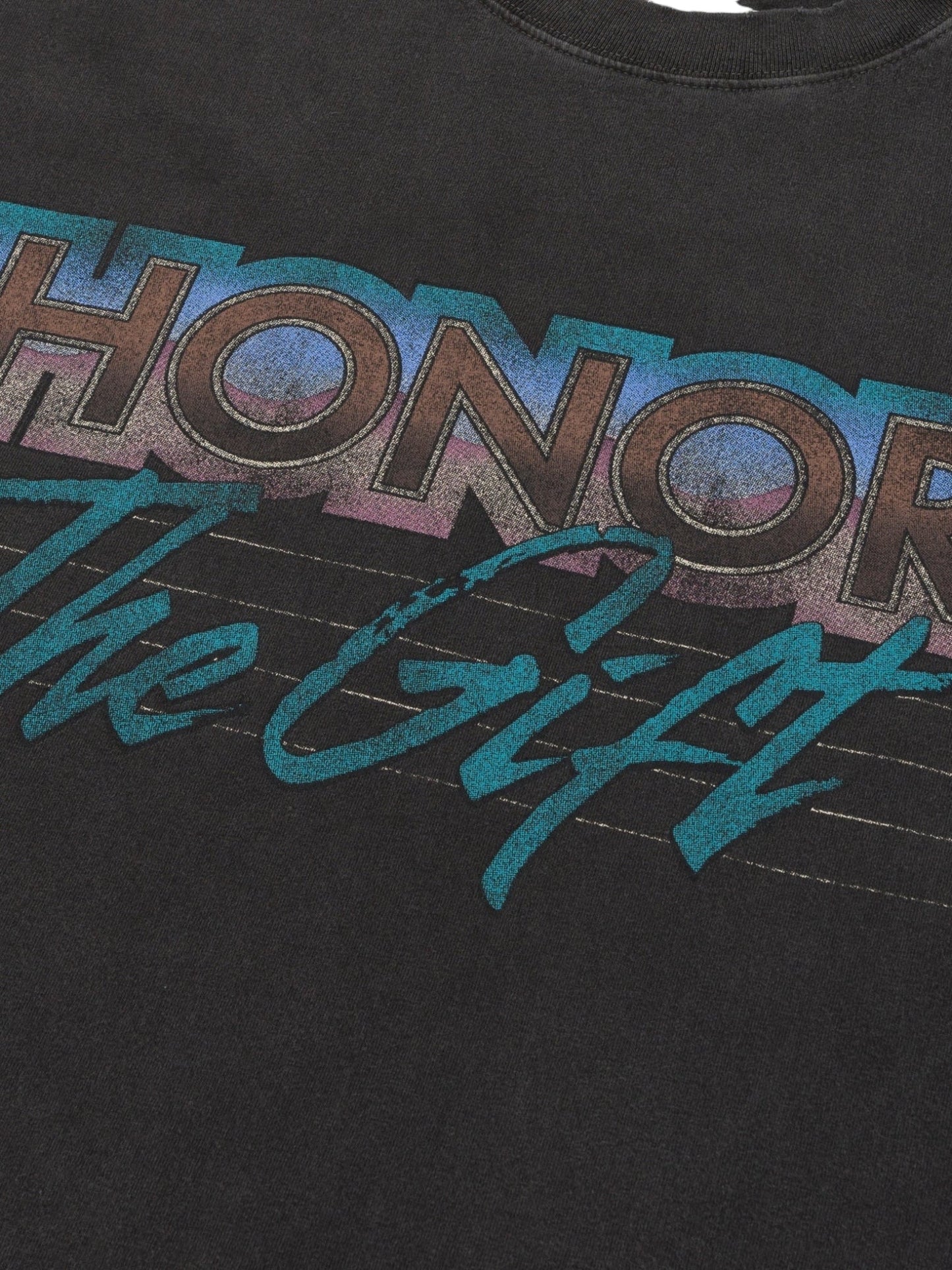 The Honor The Gift After Hours T-shirt Black showcases pigment-washed black fabric with vibrant, retro-style "HONOR The Gift" text, adding vintage charm.