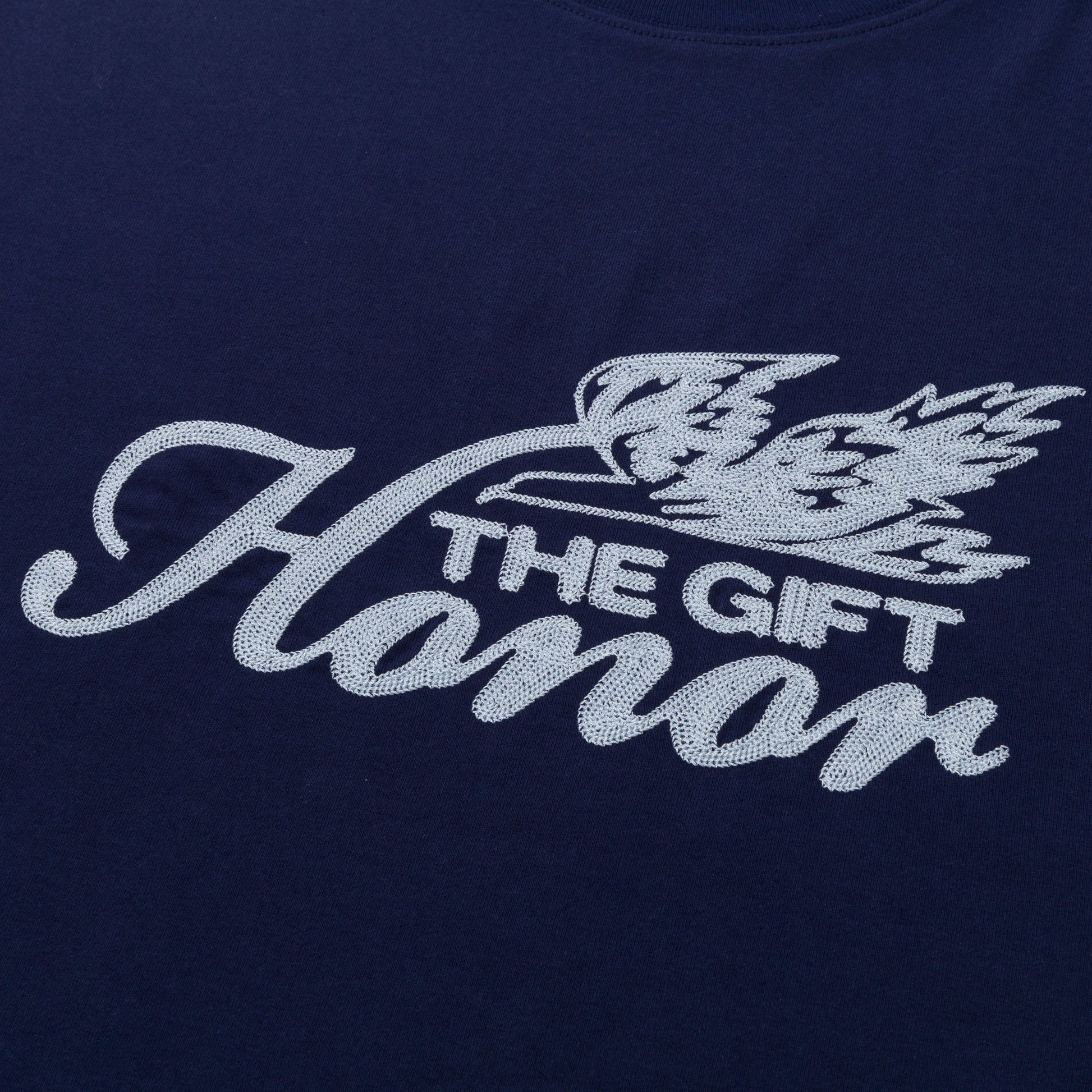 The HONOR THE GIFT Auto Club Box Tee Navy is a 100% cotton Standard Fit t-shirt featuring "Honor The Gift" and a white bird illustration on the front.