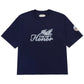 The Honor The Gift Auto Club Box Tee Navy by HONOR THE GIFT is a navy Standard Fit 100% cotton tee featuring "THE GIFT Honor" and feather graphic on the front, plus "Honor" chain stitch embroidery on the left sleeve.