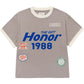 The HONOR THE GIFT Multi Box Tee Stone is a gray short-sleeve heavyweight cotton t-shirt with white trim, blue "THE GIFT Honor 1988" text, and colorful embroidered patches on the front for lasting style.