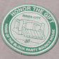 The HONOR THE GIFT Multi Box Tee Stone features a heavyweight cotton build and a patch with green and white "HONOR THE GIFT," "INNER CITY," "HOME OF THE BLOCK PARTY BOUNCE HOUSE" embroidery plus a playful bounce house illustration.
