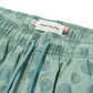 Close-up of the HONOR THE GIFT Poka Dot Short Green, crafted from polyester jacquard with an adjustable drawstring and branded waistband label.