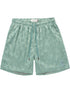The HONOR THE GIFT Honor The Gift Poka Dot Short Green is crafted from soft polyester jacquard with an elastic waistband, adjustable drawstring, side pockets, and a small embroidered logo on the left leg.