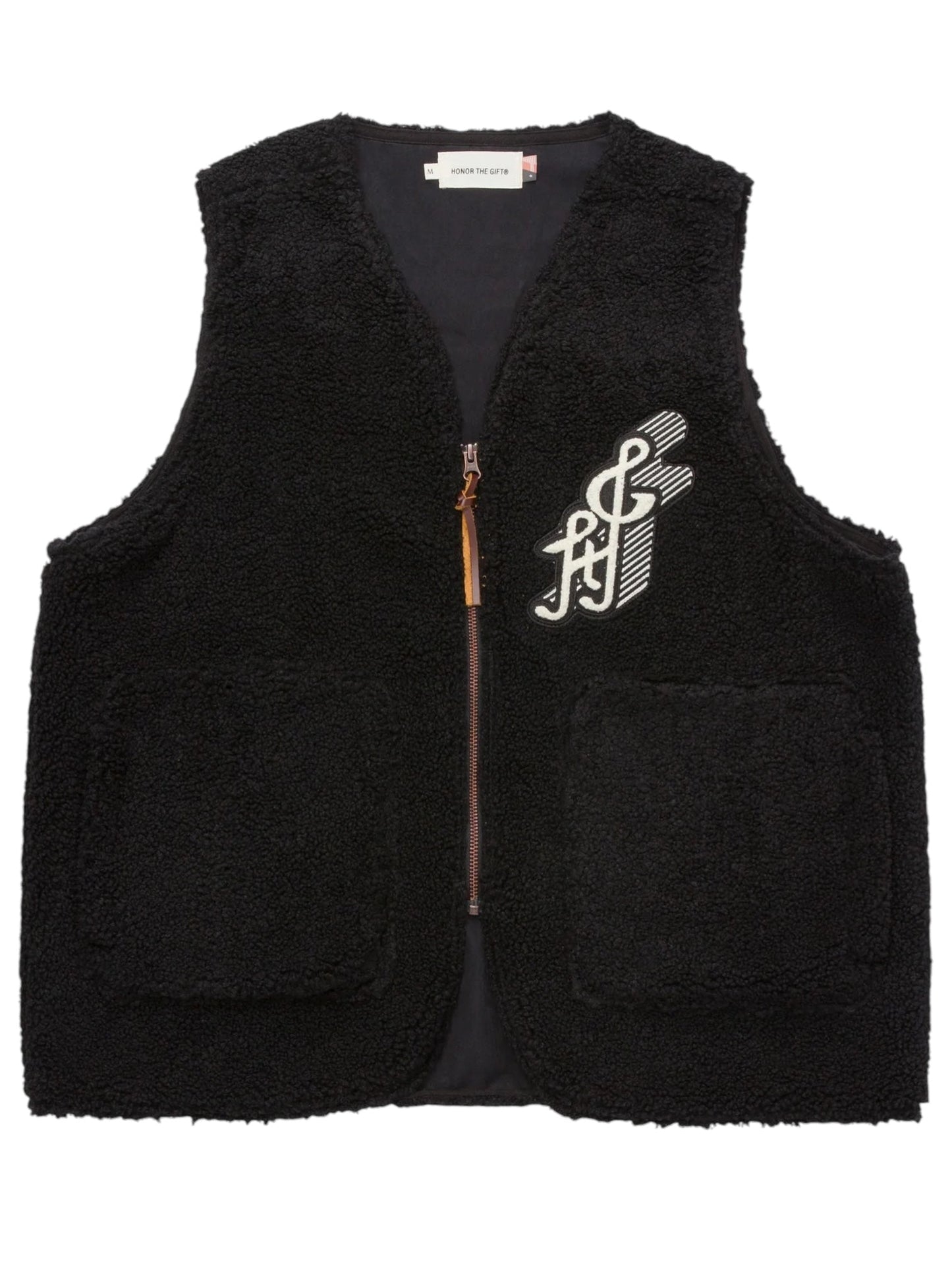 The HONOR THE GIFT TEDDY NOTES VEST in black by HONOR THE GIFT features a zip-up design with two front pockets and a white embroidered design on the left chest.