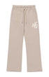 The Honor The Gift Terry HTG Sweatpant Stone by HONOR THE GIFT is made from 100% cotton in beige, featuring a drawstring waist, two front pockets, and the "HTG" initials on the left thigh.