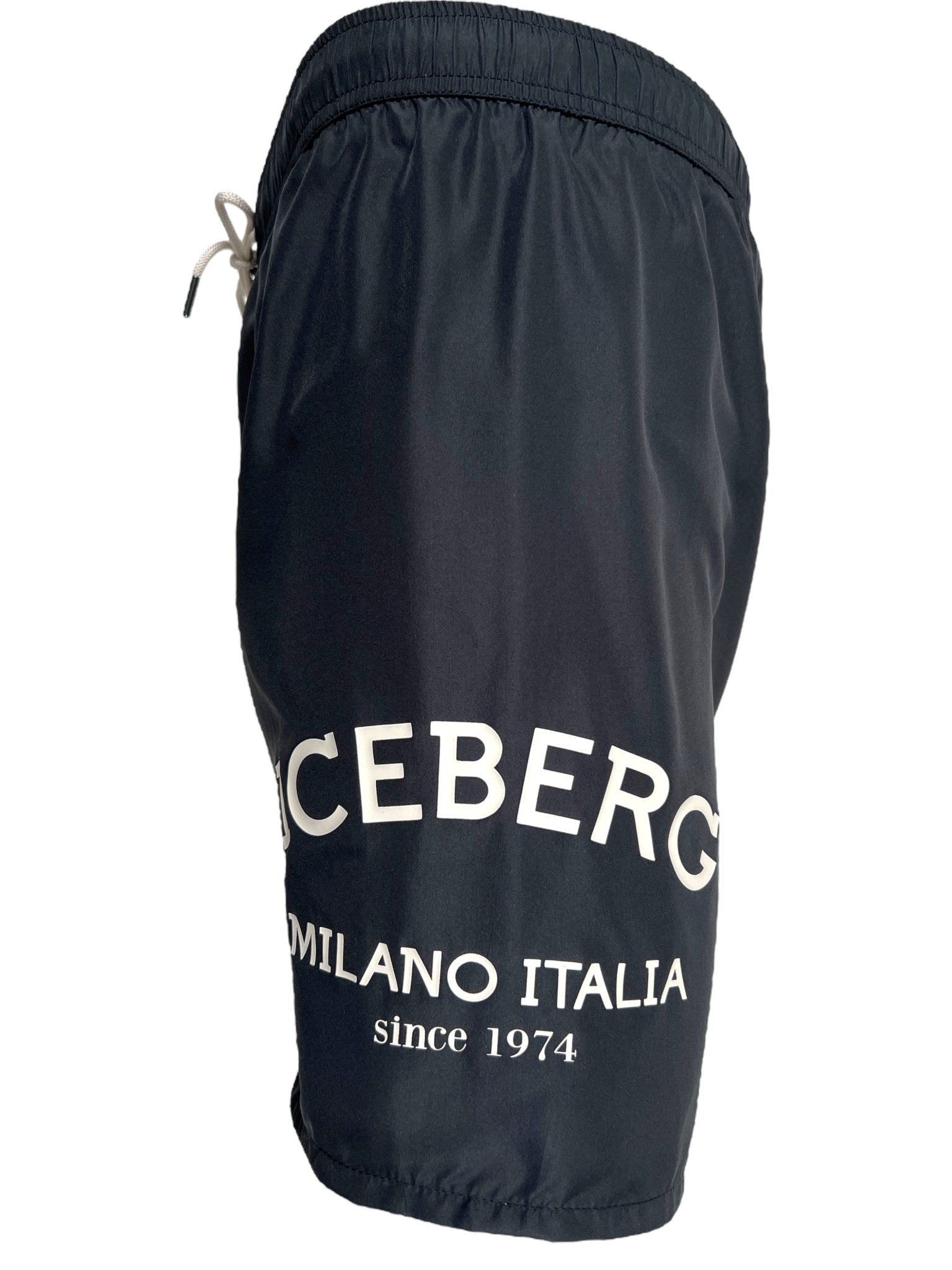 The Iceberg ICE25MBM01 Medium Boardshort in black features a white drawstring, premium polyester fabric, and bold "ICEBERG MILANO ITALIA since 1974" print on the left leg. Brand: ICEBERG.