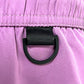 Close-up of a black D-ring on the waistband of ICEBERG’s ICE25MBM01 Medium Boardshort in Raspberry, inspired by the brand’s signature stylish trunk design.