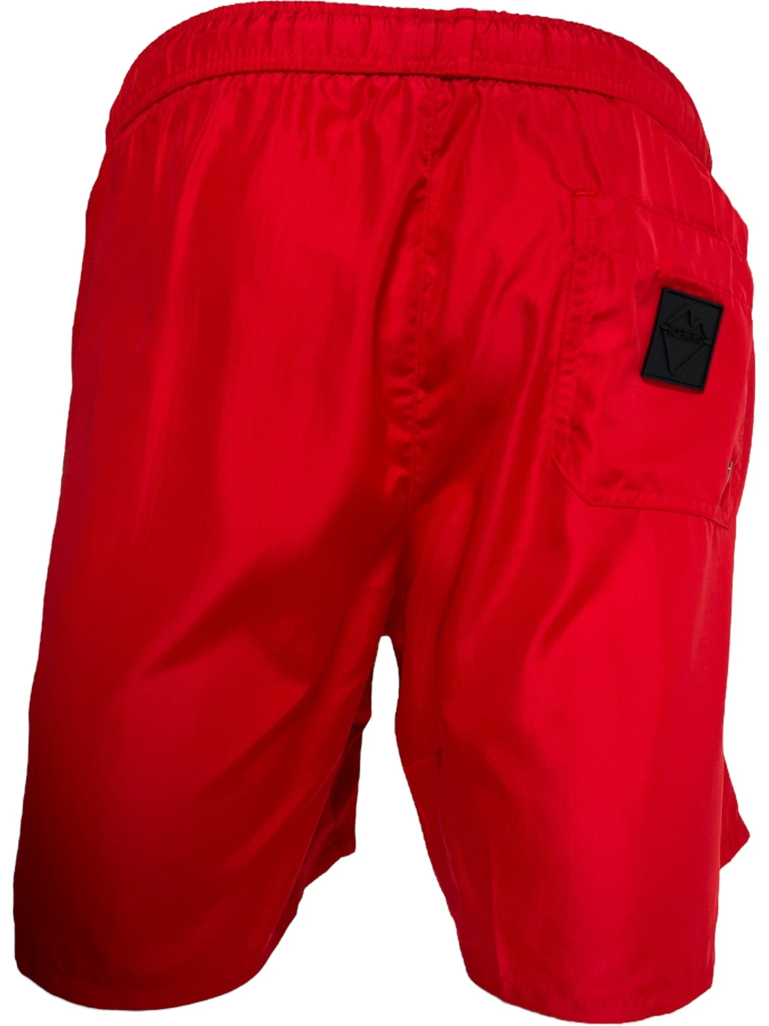The ICEBERG ICE25MBM01 Medium Boardshort in bright red for men features 100% polyester fabric, an elastic waistband, and a black logo patch on the back pocket, shown from the back.