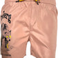 The ICEBERG ICE25MBS03 Short Boardshort Blush is a light pink 100% polyester swim trunk featuring a yellow drawstring, bear graphic with yellow eyes, and "Iceberg" and "The Icebear" text on the left leg. Imported for quality and comfort.