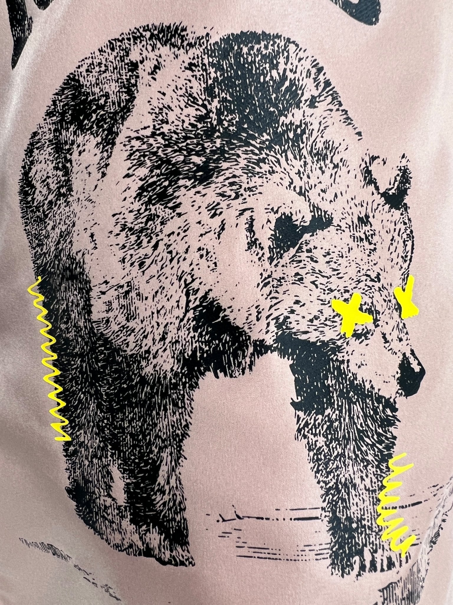 Black and white bear sketch on a light background with yellow squiggles by its legs and yellow "X" eyes, inspired by the bold style of ICEBERG’s Iceberg ICE25MBS03 Short Boardshort Blush.
