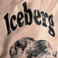 Close-up of the ICEBERG ICE25MBS03 Short Boardshort Blush, showing "ICEBERG" in bold black letters above a polar bear head graphic on 100% polyester.