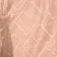 Close-up of ICEBERG ICE25MBS05 Short Boardshort Blush: light pink polyester with repeated "ICEBERG" logos and visible seam stitching—ideal for chic swim trunk style.