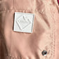 Close-up of the blush Iceberg ICE25MBS05 Short Boardshort’s light pink polyester pocket, featuring a white "ICEBERG" patch and a branded snap button.